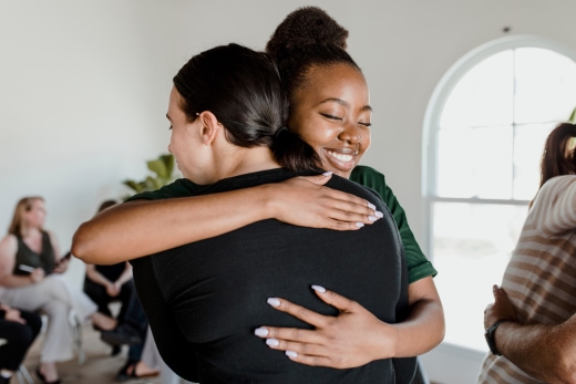Two people hugging