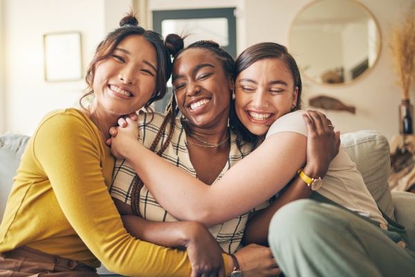 Three woman hugging